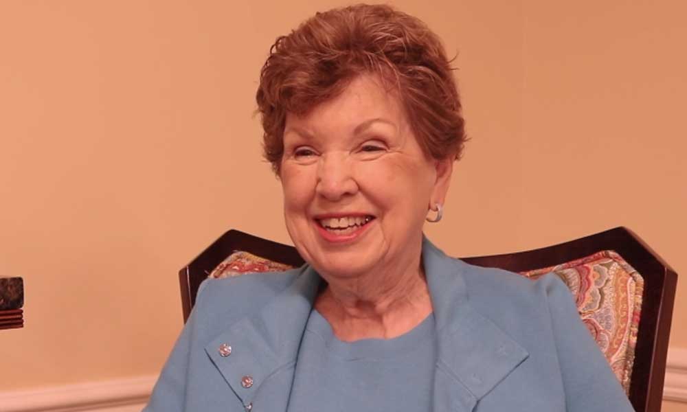 a screenshot of a video of a resident talking about why she loves living at her senior living community