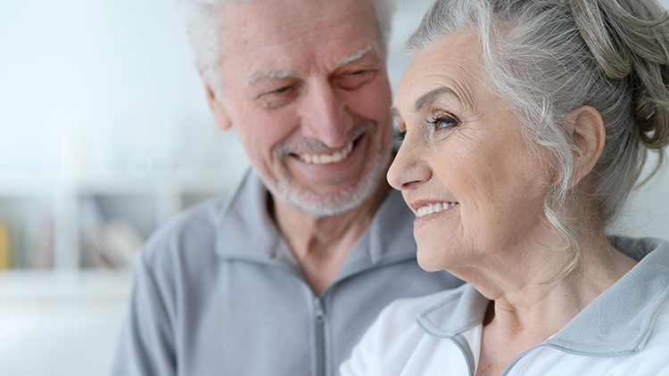 happy senior couple at home a senior couple inside of their life plan community