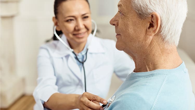 continuum-care-importance-in-retirement-blog a senior man having his heartbeat monitored by a nurse at his senior living community
