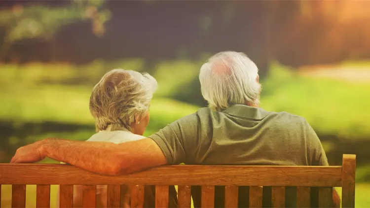 blog-non-profit a senior couple sitting on a bench outside