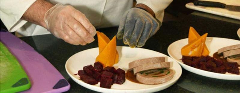 Chef Juan Fernando Ortega of Lake Forest Place preps his entree for the competition Chef Juan Fernando Ortega of Lake Forest Place preps his entree for the competition