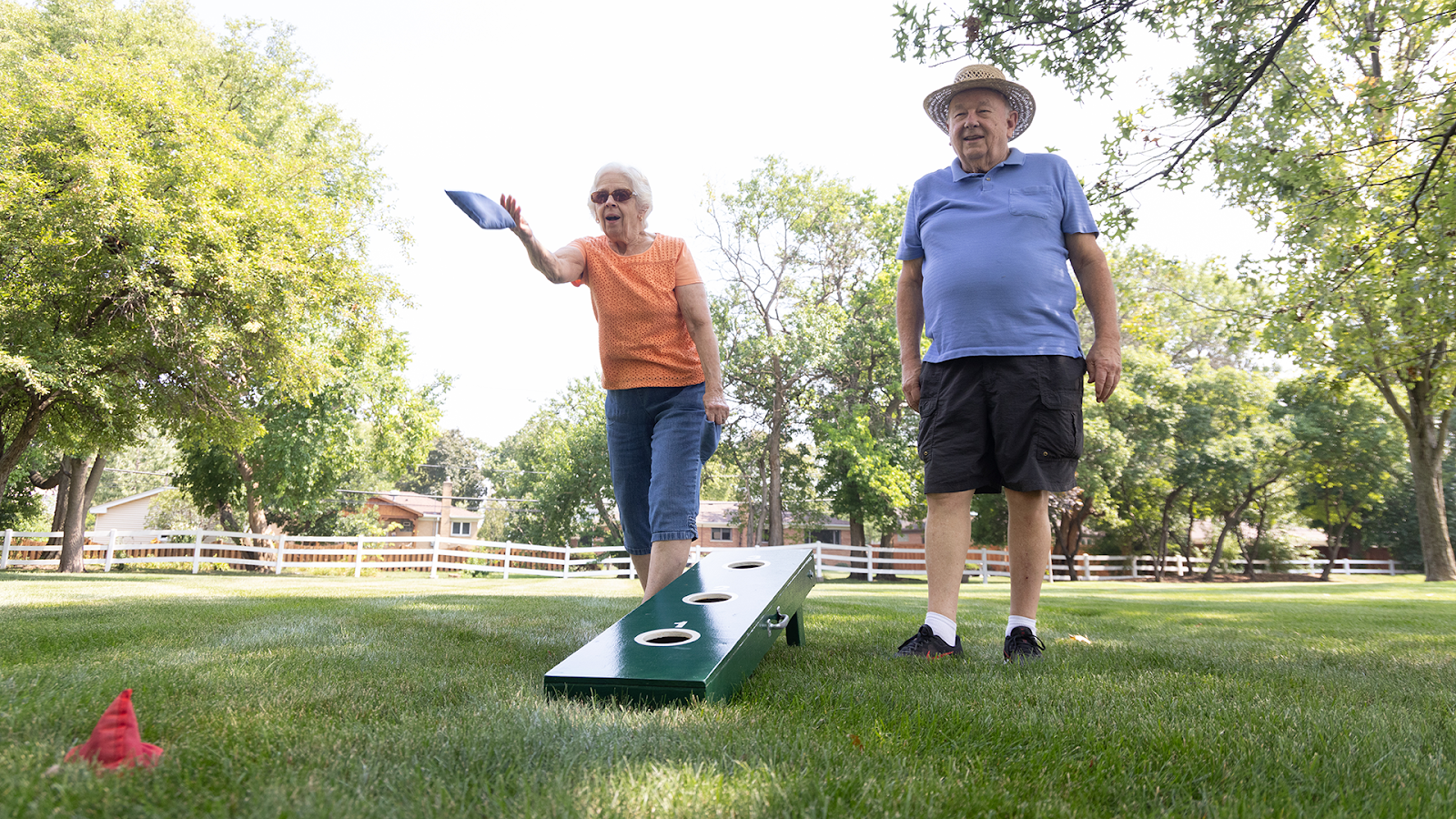 PHMA Feb Blog Hero Image Residents plaaying Corn Hole at The Moorings of Arlington Heights