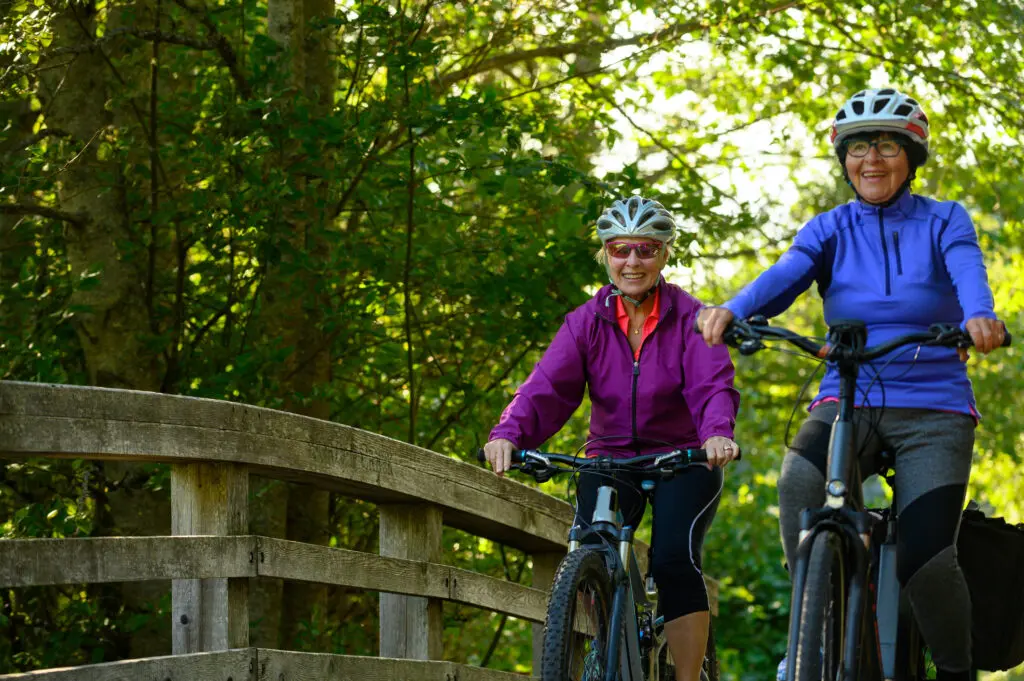 Active seniors cycling in nature
