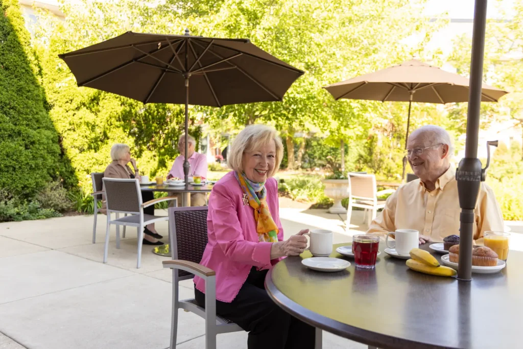 senior living residents enjoying the outdoor patio at Lake Forest Place