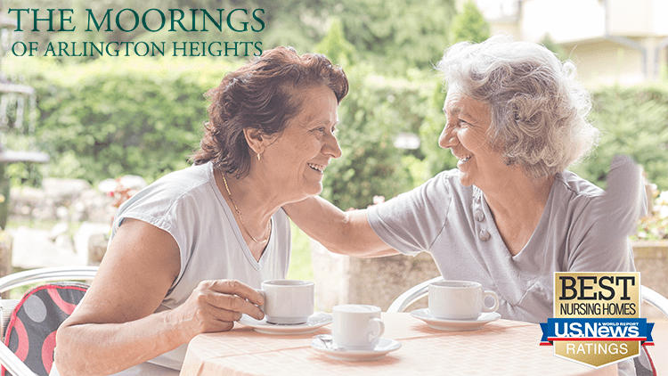 blog-TMAH two senior women enjoying cups of coffee at The Moorings of Arlington Heights senior living community