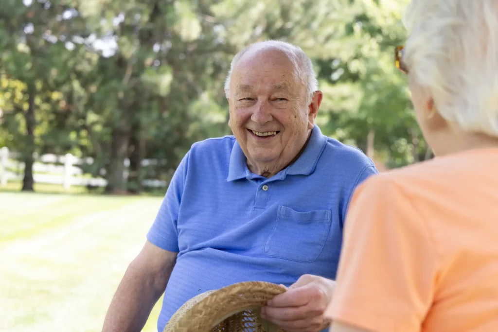 Senior man smiling at senior woman