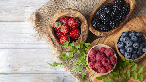 Colorful berries assortment on rustic wooden table healthy snacks for seniors include lots of berries