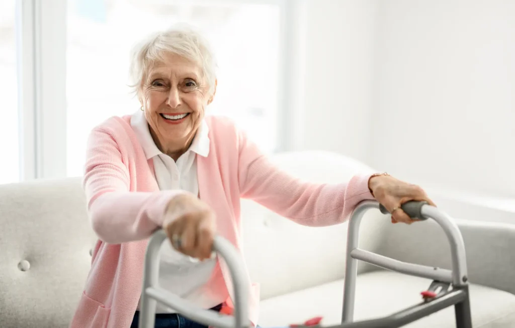 A Beautiful senior woman sitting on couch with walk chair