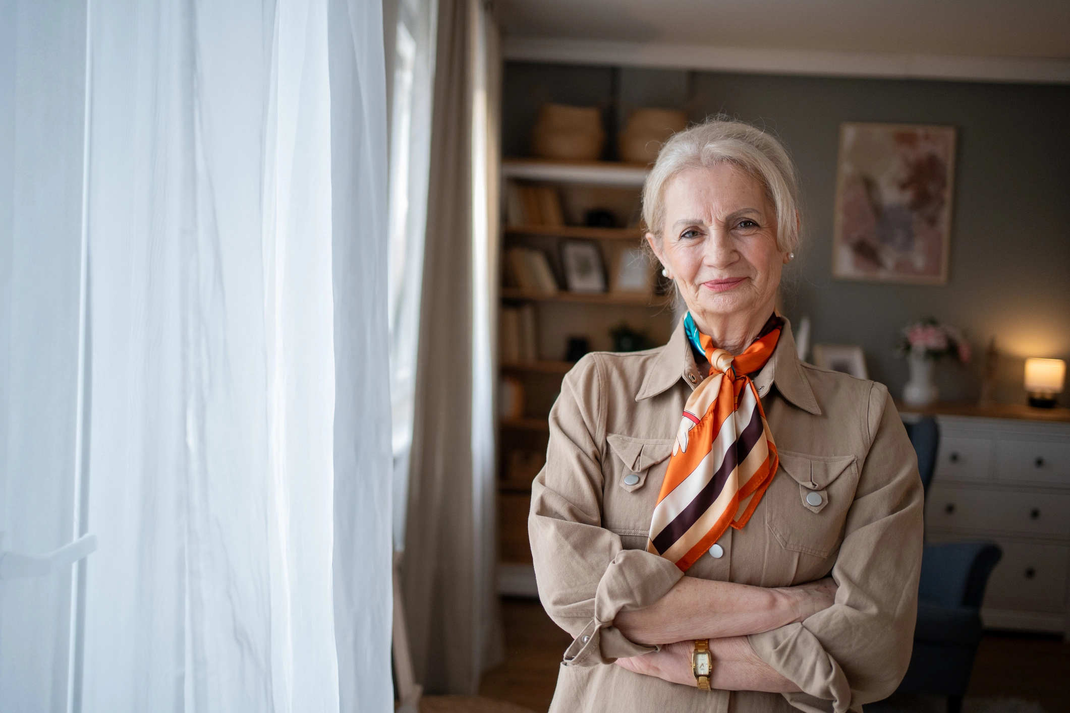 senior woman smiling by window