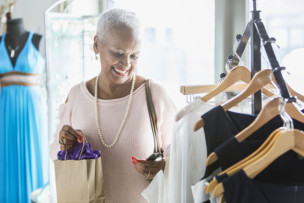 iStock-637670454-opt senior woman looking at clothing on a rack