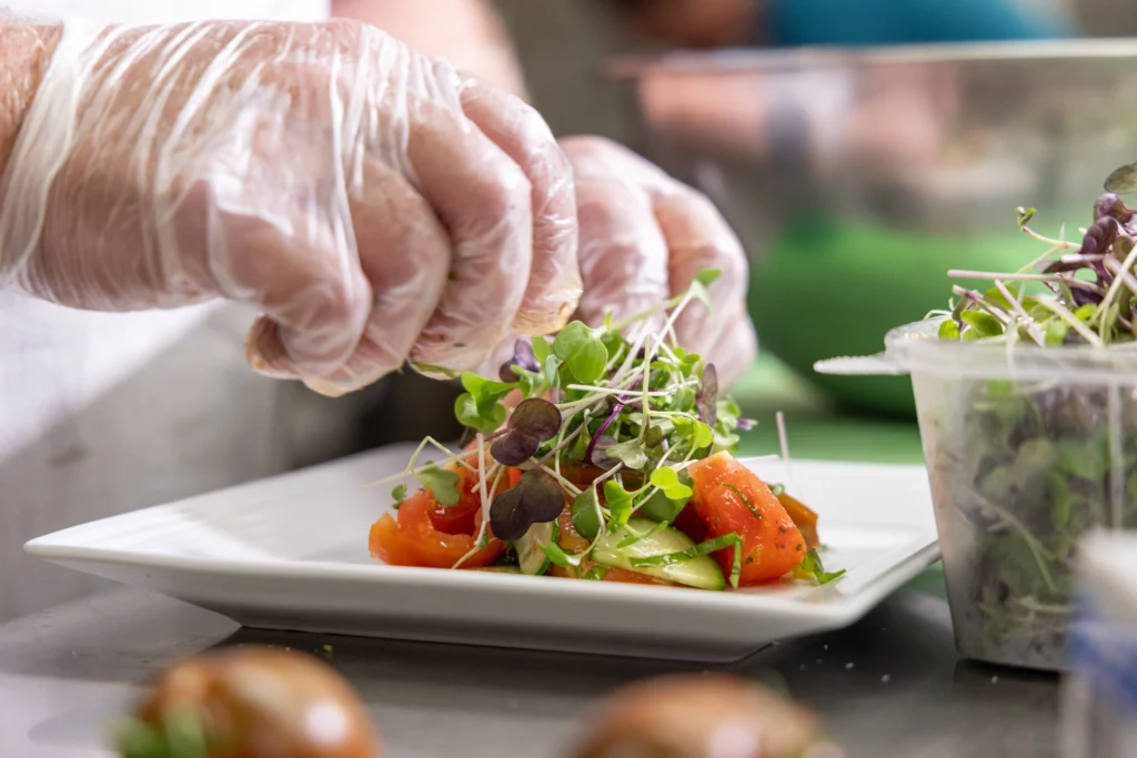 The Moorings chef prepares a colorful salad