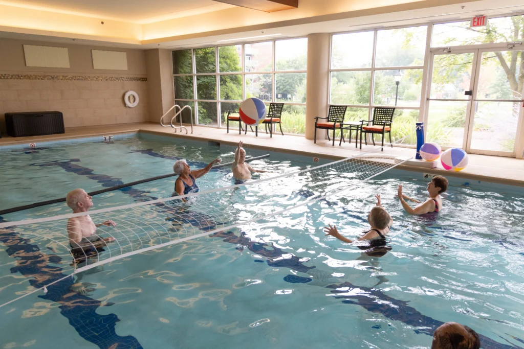 Residents at The Moorings of Arlington Heights playing in the pool