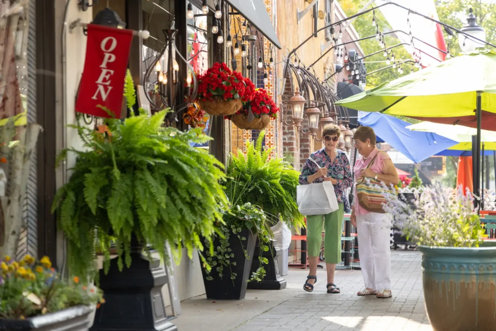 two senior residents of The Moorings of Arlington Heights enjoy the independent living amenities of the community, including being able to walk to local shops and restaurants