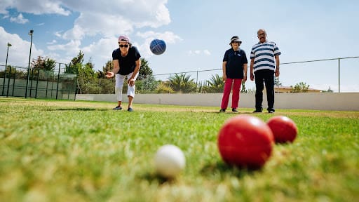 seniors playing bocce ball outside seniors playing bocce ball outside