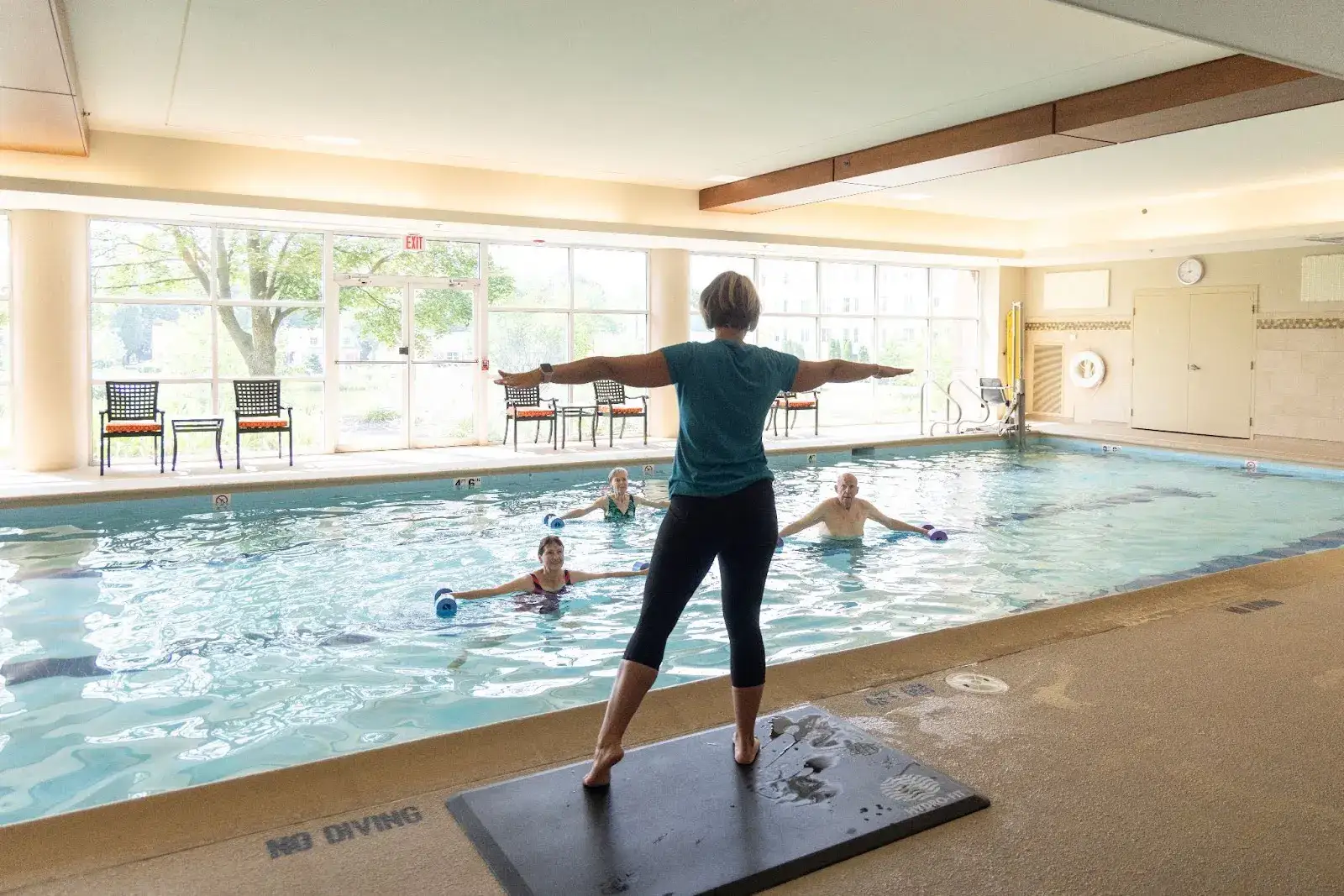 Senior aqua class doing stretching exercises for seniors in Arlington Heights, IL