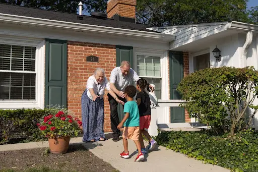 grandkids running to their grandparents in an award-winning senior living community, Evanston IL