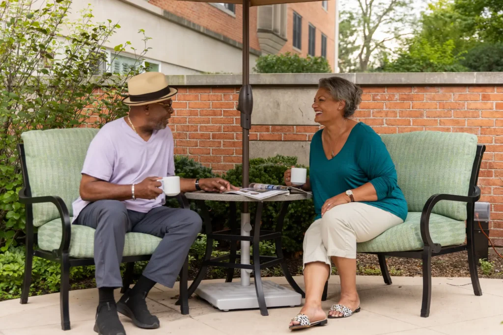 seniors sitting in the shade at Westminster Place to follow summer safety tips for seniors